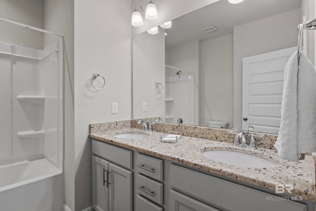 full bathroom with vanity, toilet, and shower / bathtub combination