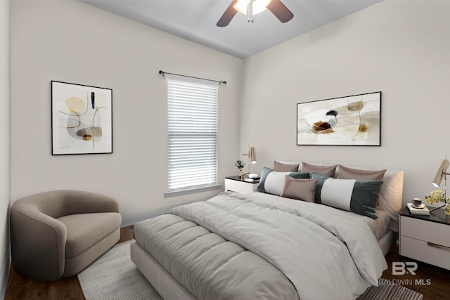 bedroom with ceiling fan and hardwood / wood-style flooring