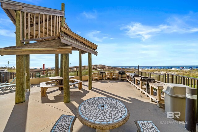 view of patio / terrace with a water view