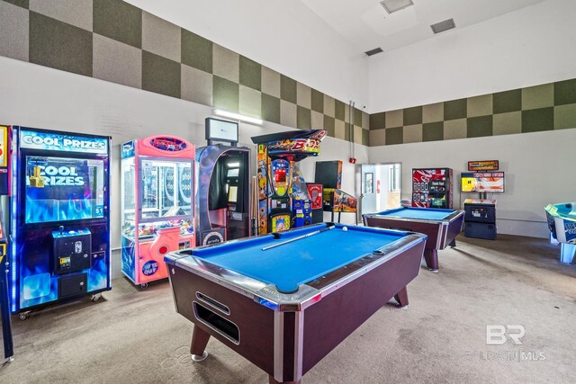 playroom featuring light carpet, a towering ceiling, and billiards