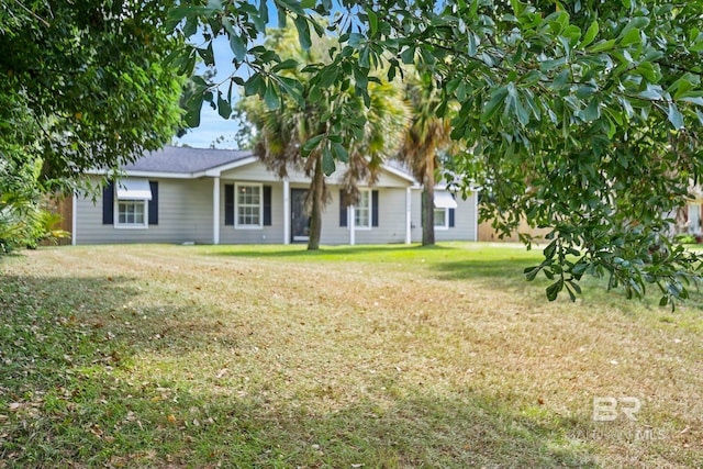 back of house with a lawn