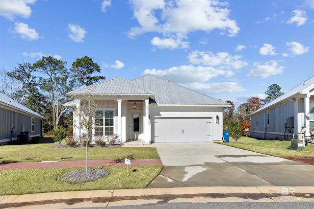 view of front of house featuring a garage and a front yard