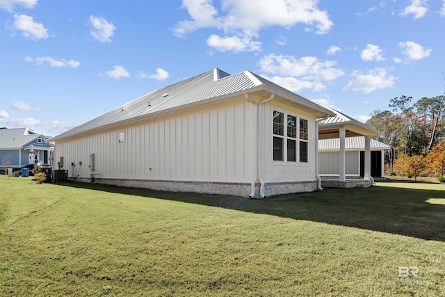 view of home's exterior with a yard