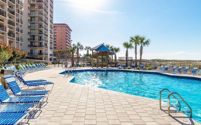 view of pool with a patio area and a gazebo