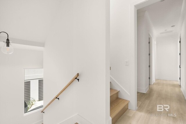 stairway featuring hardwood / wood-style flooring