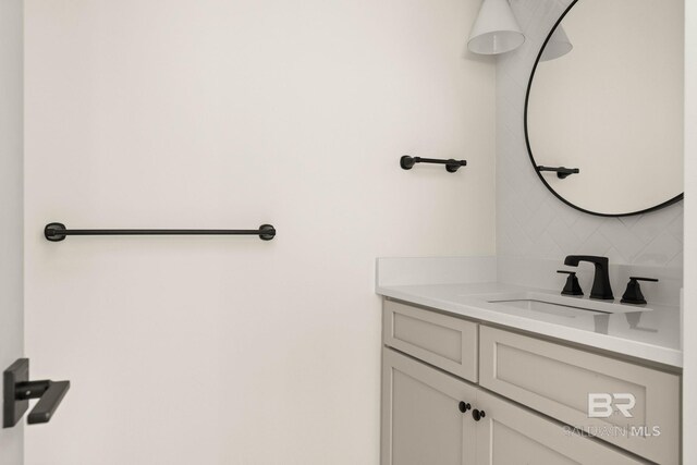 bathroom with backsplash and vanity