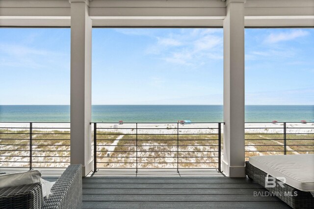 exterior space featuring a beach view and a water view