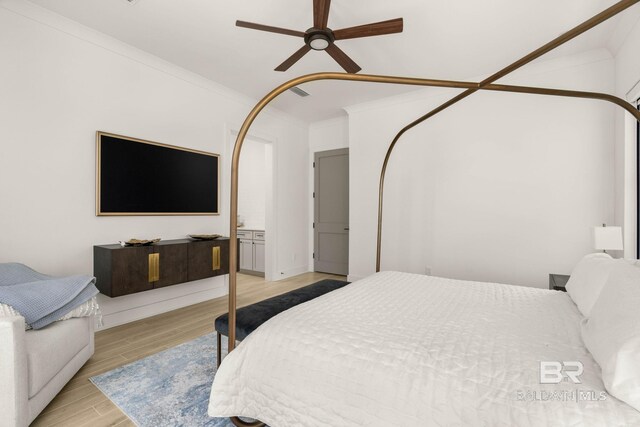 bedroom with ceiling fan, light hardwood / wood-style floors, and ornamental molding