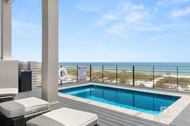 view of pool featuring a water view