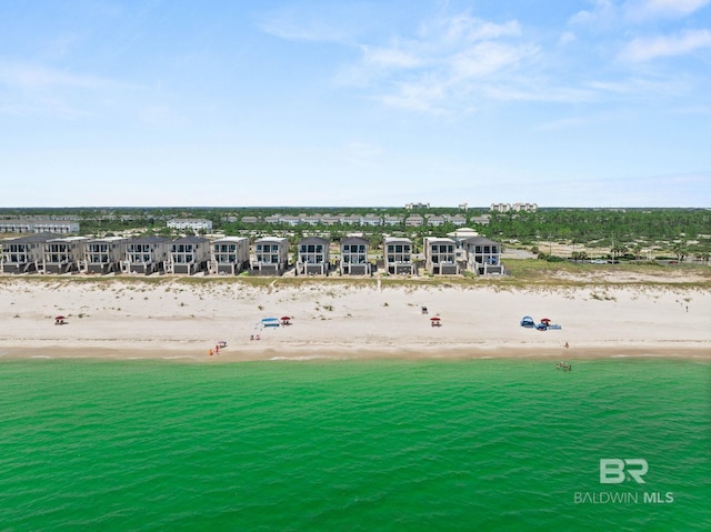 drone / aerial view featuring a view of the beach and a water view