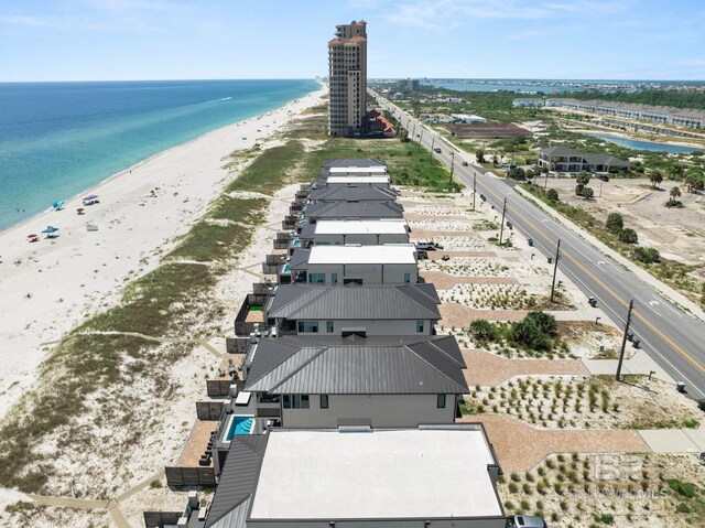 aerial view with a view of the beach and a water view