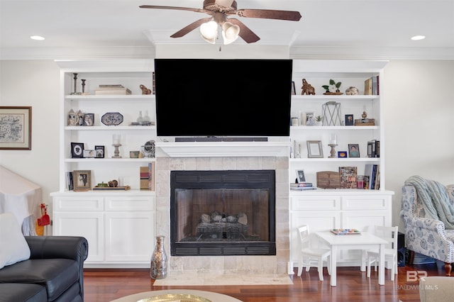 17541 Council Oaks Ln, Bon Secour, AL 36511 - living room featuring crown molding, wood finished floors, ceiling fan, a fireplace, and built in features
