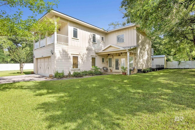 17541 Council Oaks Ln, Bon Secour, AL 36511 - view of property featuring french doors, driveway, board and batten siding, and an attached garage