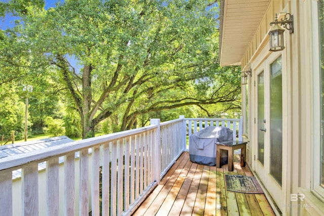 17541 Council Oaks Ln, Bon Secour, AL 36511 - wooden terrace with area for grilling and view of scattered trees