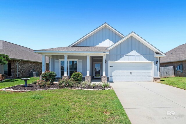 view of front of house with board and batten siding, an attached garage, central air condition unit, concrete driveway, and covered porch