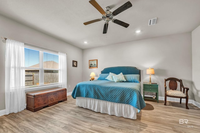 bedroom with baseboards, wood finished floors, a ceiling fan, and recessed lighting