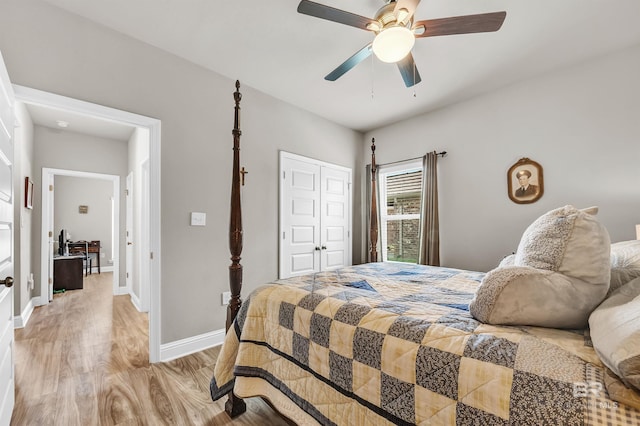 bedroom with light wood finished floors, a closet, baseboards, and a ceiling fan