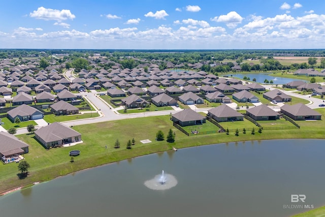 aerial view of residential area featuring a nearby body of water