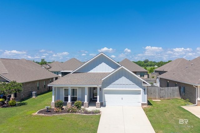 craftsman-style house with board and batten siding, an attached garage, cooling unit, concrete driveway, and a shingled roof