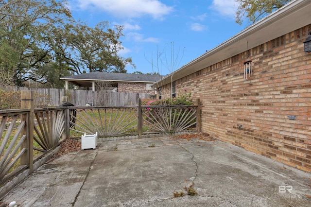 view of patio featuring fence