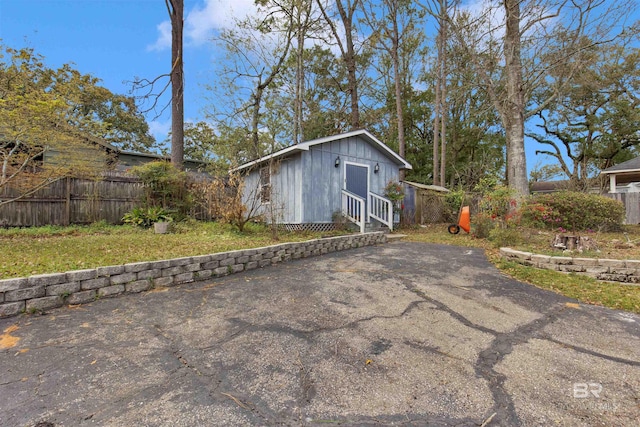 exterior space featuring entry steps and fence