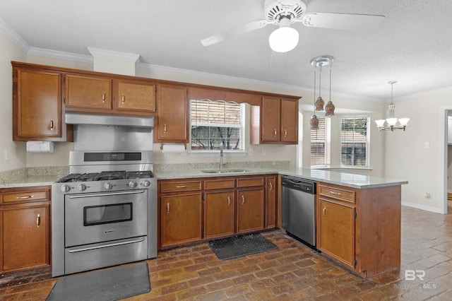 kitchen featuring brown cabinets, under cabinet range hood, a sink, stainless steel appliances, and a peninsula