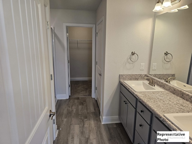 bathroom featuring vanity and hardwood / wood-style flooring