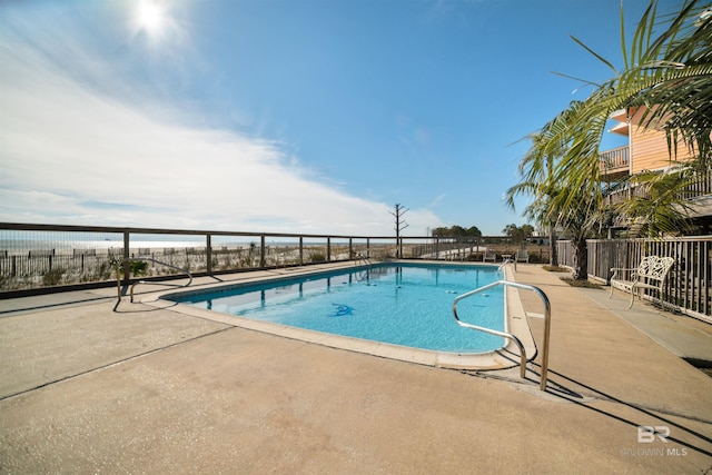 view of pool featuring a patio