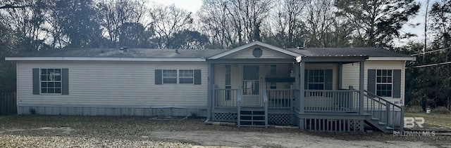 manufactured / mobile home featuring covered porch