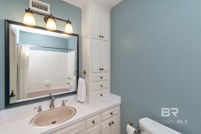 3755 N Claridge Rd, Mobile, AL 36608 - bathroom with toilet, vanity, and shower / bathtub combination with curtain