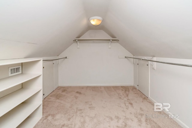 3755 N Claridge Rd, Mobile, AL 36608 - walk in closet featuring light colored carpet and vaulted ceiling