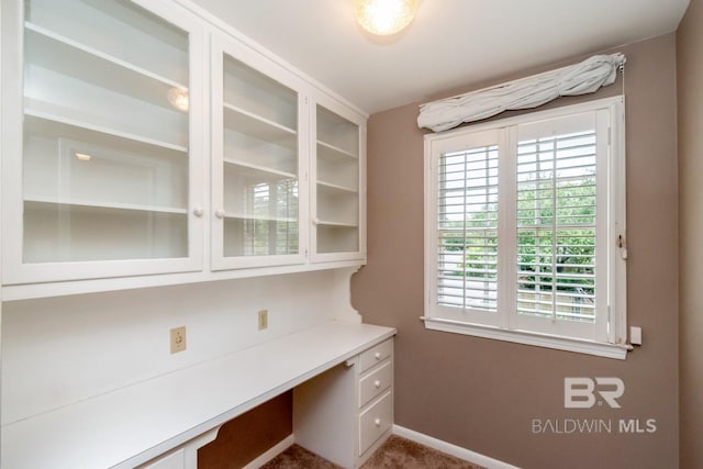 3755 N Claridge Rd, Mobile, AL 36608 - unfurnished office featuring built in desk, baseboards, and carpet floors