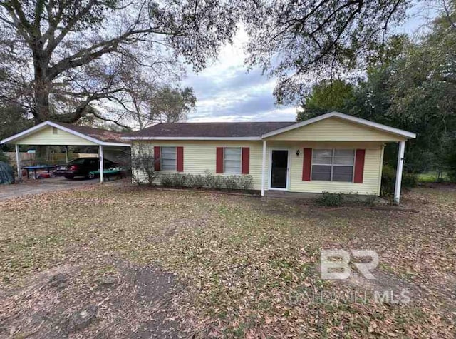 single story home featuring a carport