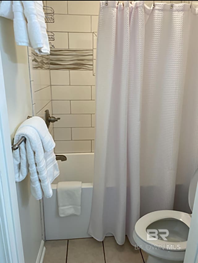 16310 Perdido Key Dr, Pensacola, FL 32507 - bathroom featuring tile patterned flooring, shower / tub combo with curtain, and toilet