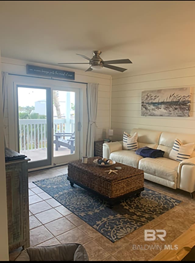 16310 Perdido Key Dr, Pensacola, FL 32507 - tiled living room with a ceiling fan and wooden walls