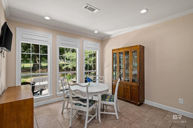 9791 Aspen Cir, Spanish Fort, AL 36527 - dining room featuring healthy amount of natural light, ornamental molding, light tile patterned floors, and recessed lighting