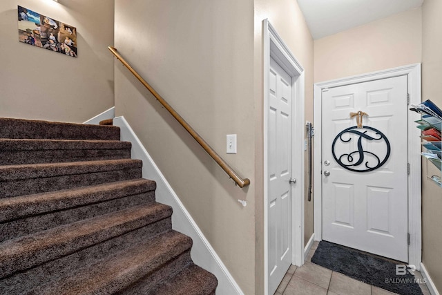 9791 Aspen Cir, Spanish Fort, AL 36527 - entrance foyer featuring light tile patterned floors and stairway