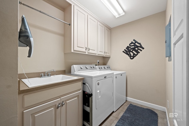 9791 Aspen Cir, Spanish Fort, AL 36527 - laundry area with washing machine and clothes dryer, cabinet space, light tile patterned floors, and electric panel