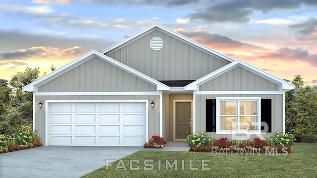 view of front of house featuring a garage and a lawn