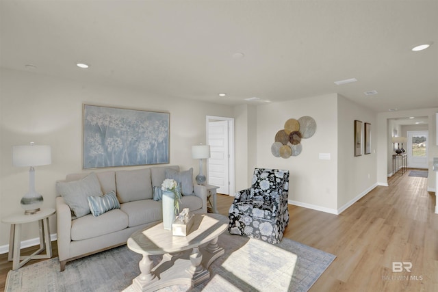 living room with light hardwood / wood-style flooring