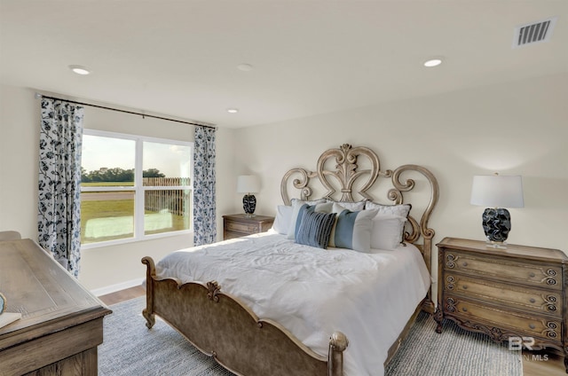 bedroom with light hardwood / wood-style flooring