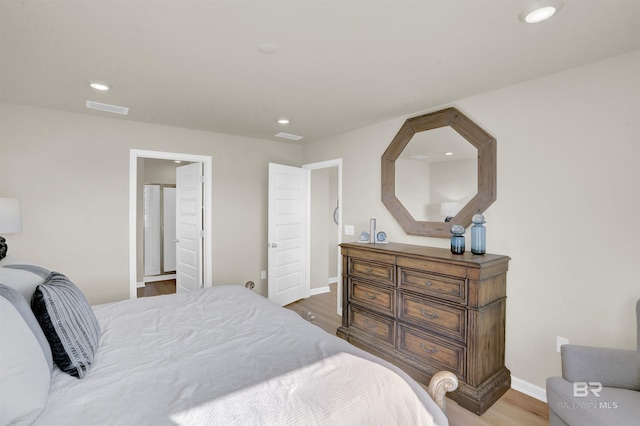 bedroom with hardwood / wood-style floors