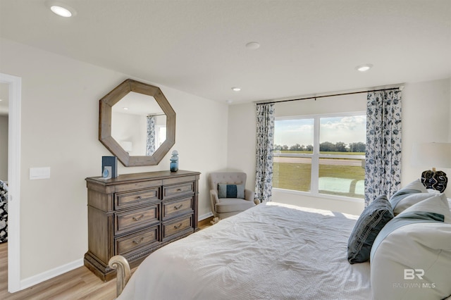 bedroom featuring light wood-type flooring