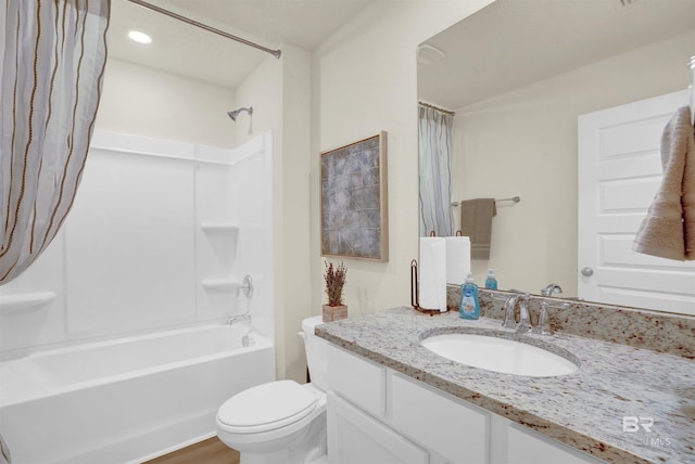 full bathroom featuring hardwood / wood-style flooring, vanity, toilet, and shower / bath combo with shower curtain