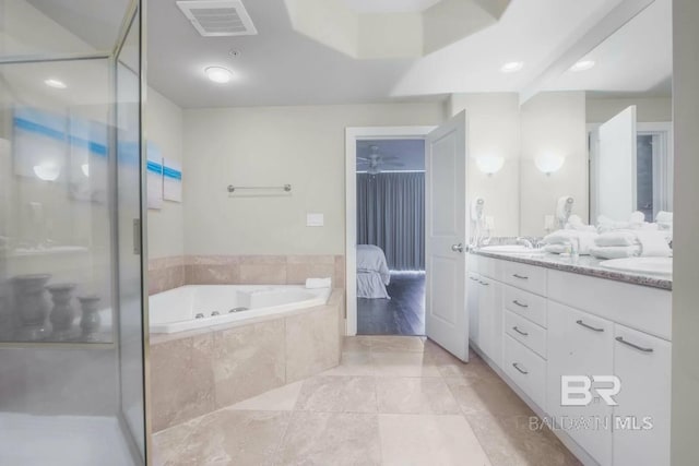 28107 Perdido Beach Blvd Unit D209, Orange Beach, AL 36561 - ensuite bathroom featuring a garden tub, double vanity, and a shower stall