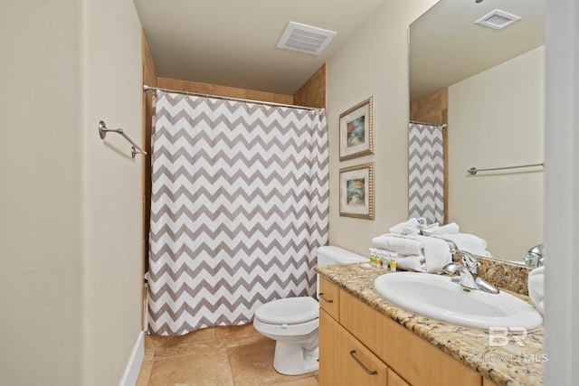 28107 Perdido Beach Blvd Unit D209, Orange Beach, AL 36561 - bathroom featuring toilet, vanity, baseboards, stone finish floors, and a shower with shower curtain
