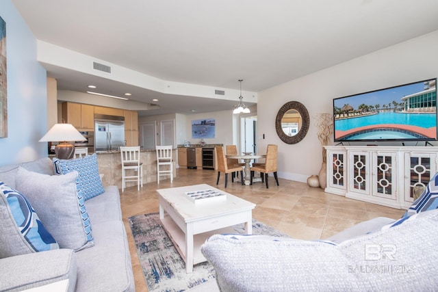28107 Perdido Beach Blvd Unit D209, Orange Beach, AL 36561 - living area with beverage cooler, recessed lighting, baseboards, and light tile patterned floors