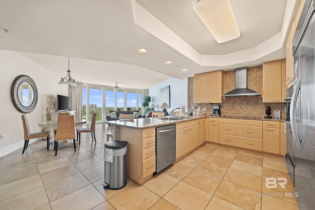 28107 Perdido Beach Blvd Unit D209, Orange Beach, AL 36561 - kitchen featuring wall chimney exhaust hood, light brown cabinets, dishwasher, tasteful backsplash, and a sink
