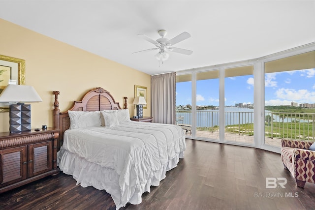 28107 Perdido Beach Blvd Unit D209, Orange Beach, AL 36561 - bedroom featuring expansive windows, access to exterior, dark wood-style floors, and a water view