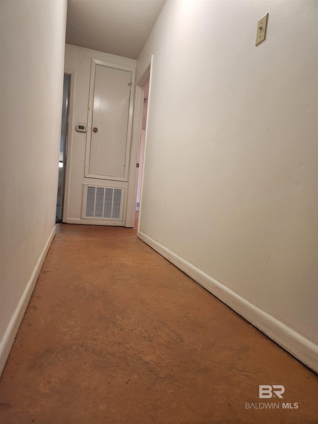 6128 N Lindholm Dr, Mobile, AL 36693 - hall with baseboards and concrete flooring